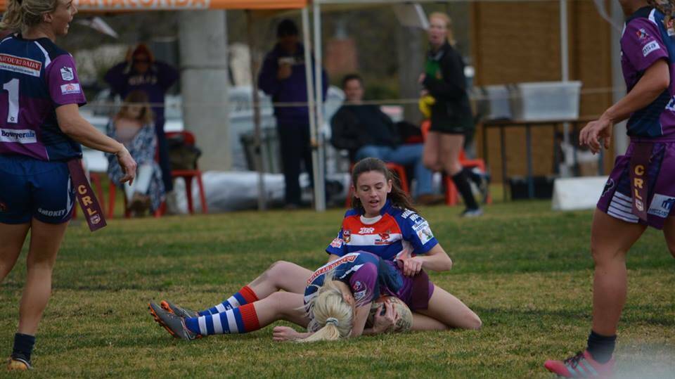 I'LL TAKE THIS: Anna Hall tags a SouthCity player last weekend in Wagga. Photo: Rebecca Goodlock.