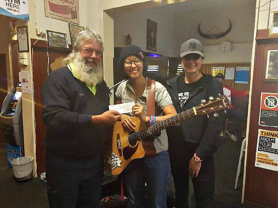 FOR A GREAT CAUSE: Wombat Hotel Social Club president Chris Holmes, singer and fundraiser Mel Yeates and Holly McLeod from the Wombat Hotel. Photo: Supplied.