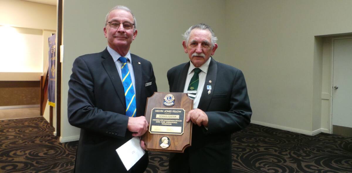 OUTGOING AND INCOMING: Outgoing president Stuart Freudenstein presenting incoming president Dennis Foster with the Melvin Jones Award.