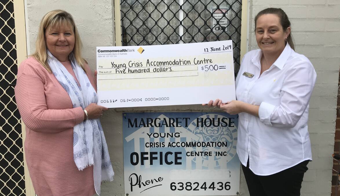 Gwen Gunning from Young Crisis Accommodation Centre receiving the cheque from Commonwealth Bank Young Branch Manager Sarah Sullivan.
