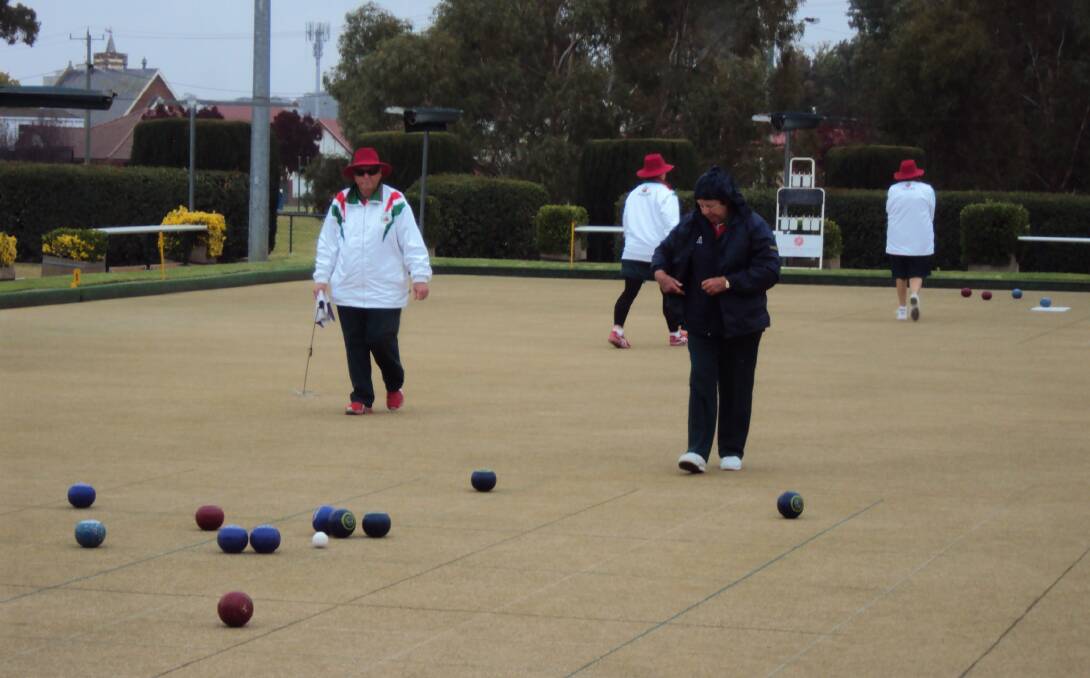BRRR, IT'S CHILLY: Bowlers rug up last week while playing and battled on despite the cold and wet weather.