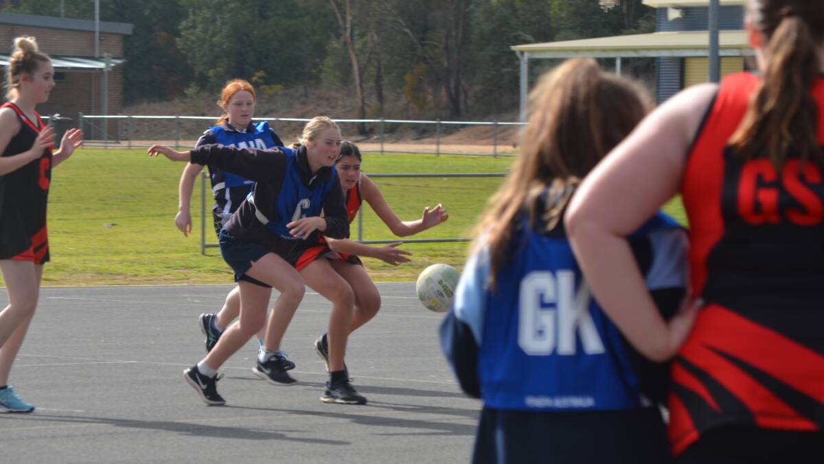 Tanna Roberts puts it all on the line as she chases down the ball against a Boorowa player.