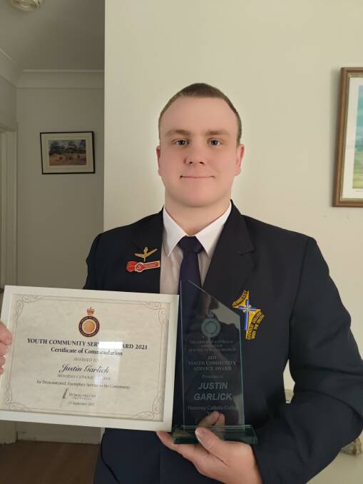 Hennessy Catholic College student Justin Garlick with is OAA awards. Photo: Supplied