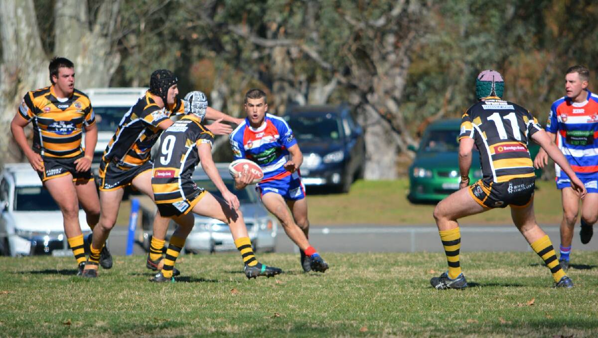 COME AND GET IT: Zac Sell takes on the Tigers in the Under 18s match last weekend. Photo: Rebecca Goodlock. 