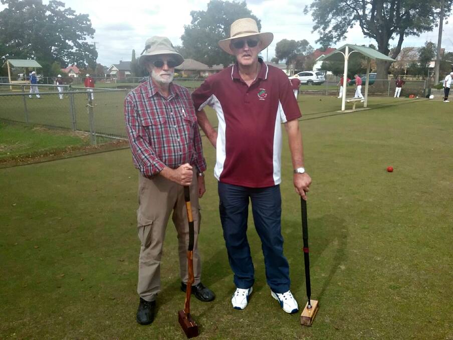 HITTING OFF: Peter Druitt from Young and an opponent from the Blue Mountains. Photo: Supplied.
