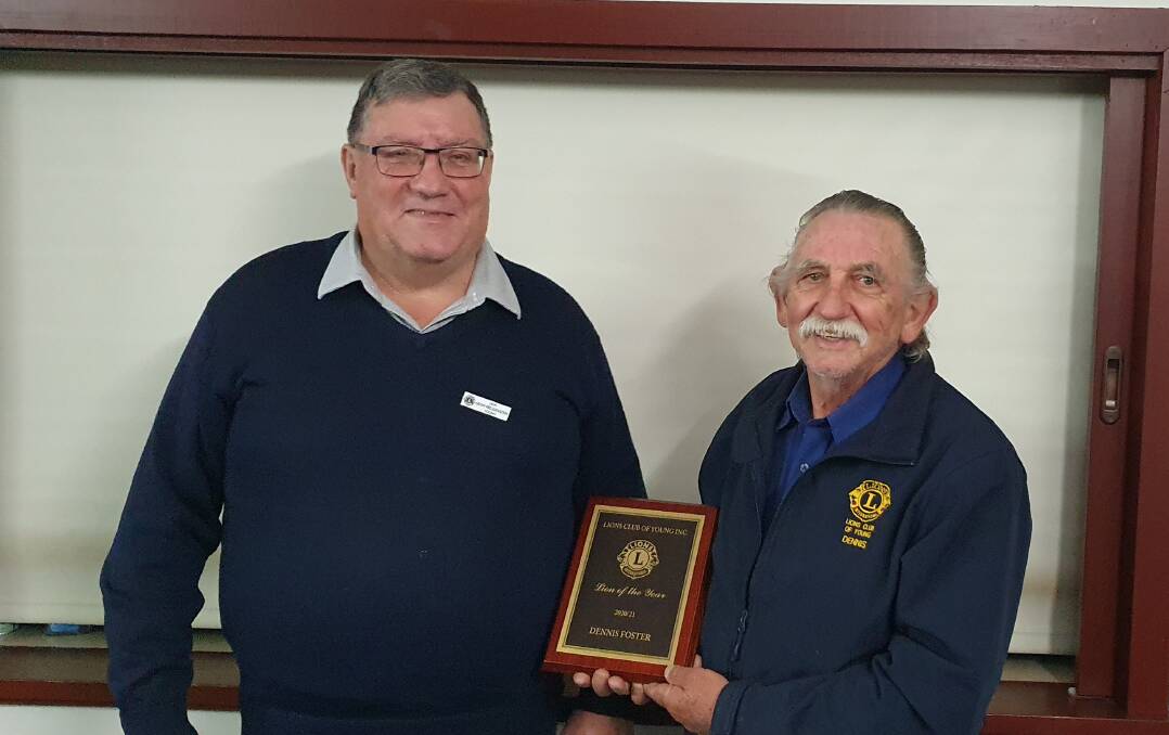 Lion Dennis receiving his Lion of the Year Award from Past President Geoff.