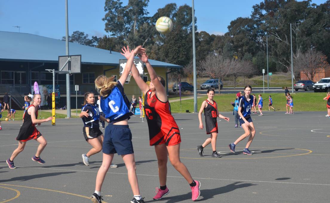 Tanna Roberts reaches for the ball during Young High School's game against Boorowa Central School.