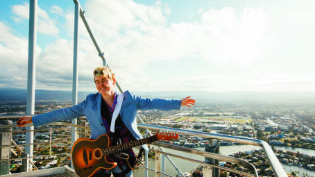 SOARING HIGH: Alex The Astronaut performing on top of Australia's tallest building, SkyPoint, on the Gold Coast. Picture: Mitch Fresta