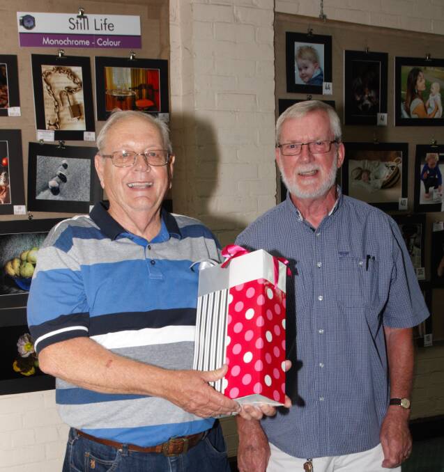 Judge, Graeme Culbert being presented with a thank you gift
for judging by Young Camera Club president Trevor Faulkes.