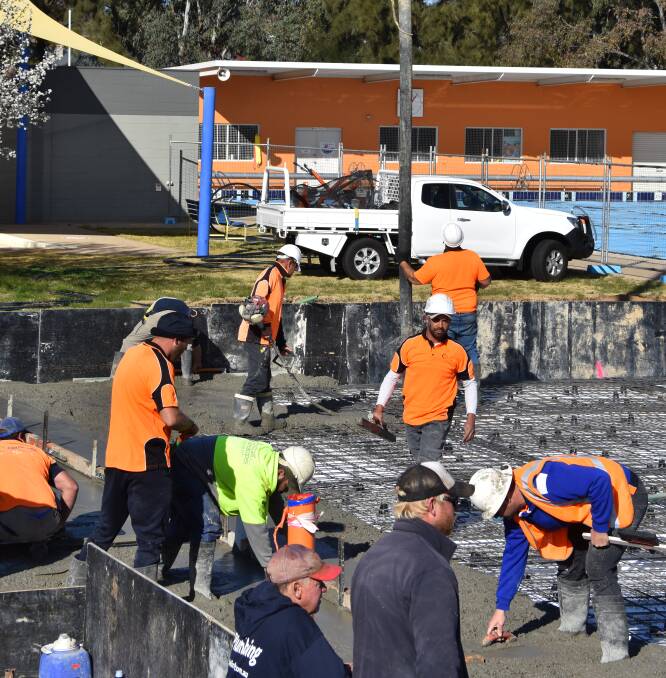 Workers on site during the concrete pour at the Young Swimming Pool on Thursday morning.
