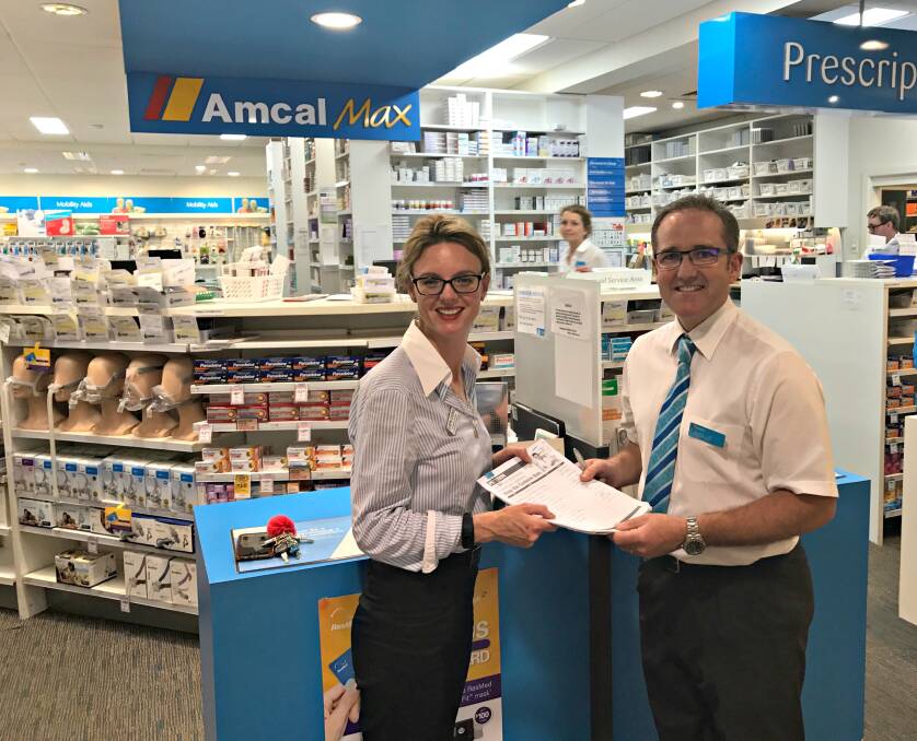 Sensible approach: The Nationals Steph Cooke receiving a petition from Pharmacist David Hamblin supporting the Nats codeine call.