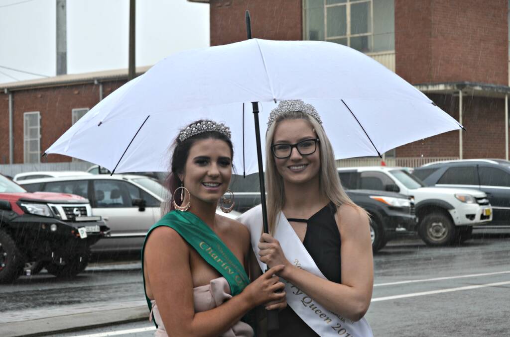 Reigning Queens: Charity Queen Emma Blake and Cherry Queen Jade Nolan braved the rain and kept busy all weekend with official duties. Photo: Craig Thomson.