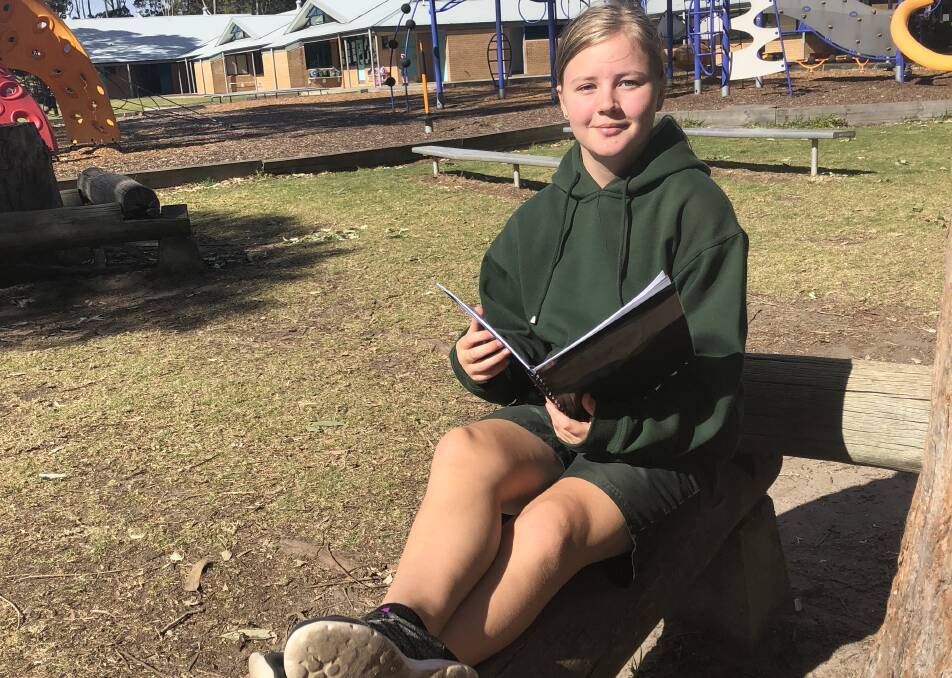 Talented writer Kaitlyn Sell received an award at Sunshine Bay Public School's assembly on Wednesday, August 8, to coincide with education week.