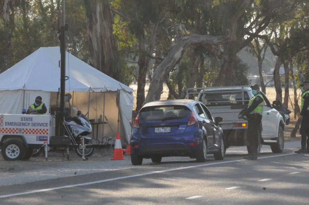 Above: Modern day checkpoint. Police stop cars in South Australia about 25 kilometres from the Victorian border as part of a shutdown sparked by COVID-19. Picture: BORDER CHRONICLE