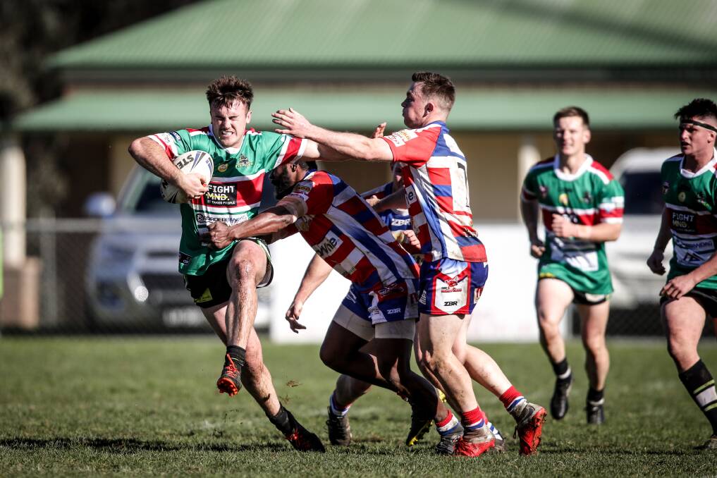 Thunder's Liam Wiscombe tries to palm away Young halfback Jesse Corcoran. The Cherrypickers were unable to get on the scoreboard. Picture: James Wiltshire