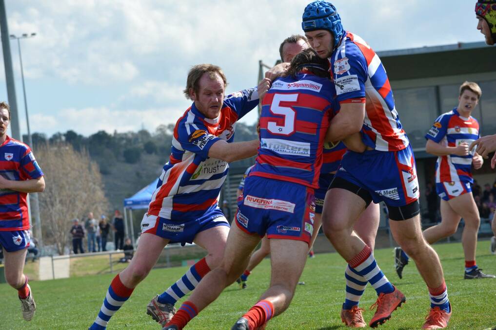 Shawn Brown and Kye Tiedemann stop the attack of the Roos. Photo: Young Cherrypickers RLFC. 