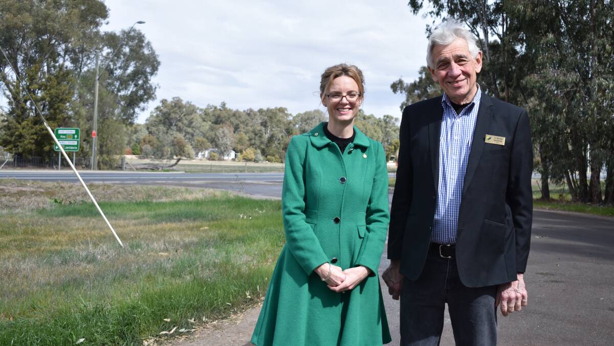 Steph Cooke MP and Mayor of Narrandera, Neville Kschenka, by the Sturt Highway. 