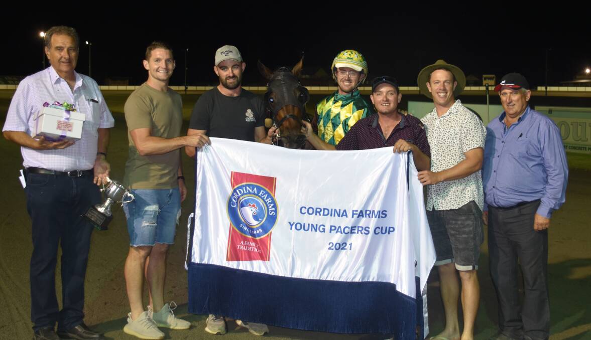 Brad Hewitt and Our Triple Play pictured with connections and representatives from Young Harness Racing Club and Cup sponsor Cordina Farms. Photo: Peter Guthrie