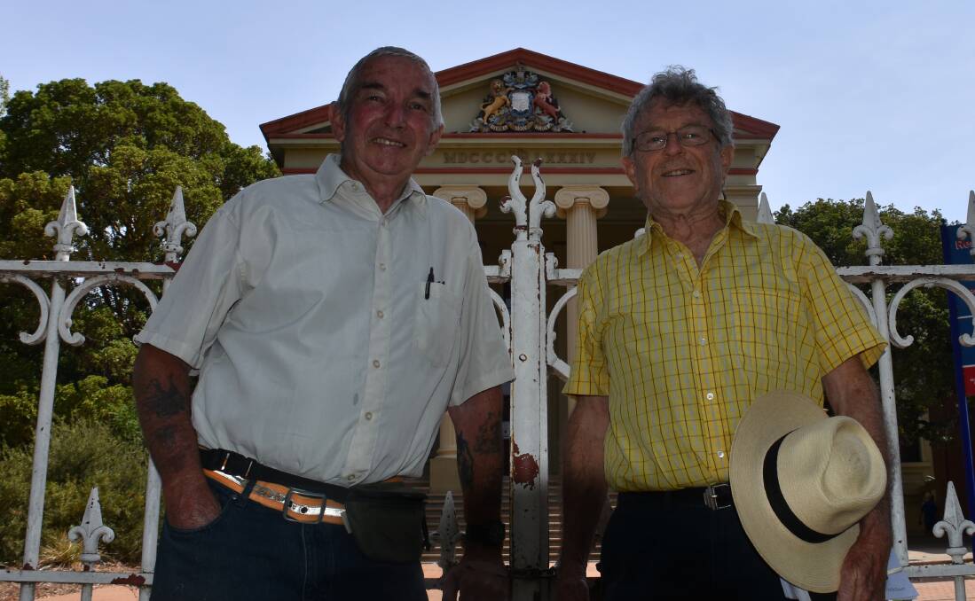 Steve Watkins, who says he once walked a tunnel in 1992 between the old courthouse and old jail, and history expert Joe Kinsela pictured in front of the old courthouse. Photo: Peter Guthrie