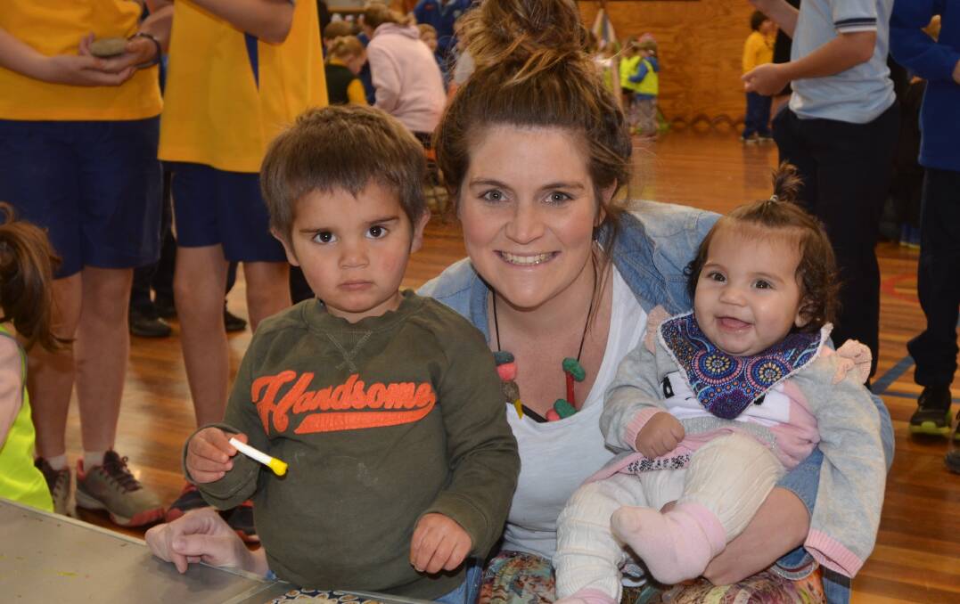 Rach Berry (middle) with her children Alfie and Sadie Kirby enjoying rock painting.
