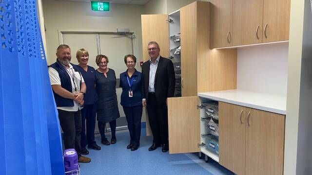 Darren Green Oncology fundraiser committee member, Ulla Smithers Oncology RN, Angela Power Oncology RN, Del Hill Oncology RN and Mark Sheridan Oncology fundraiser committee member in front of the Oncology refurbishment in the Young Oncology Unit. Photo: contributed