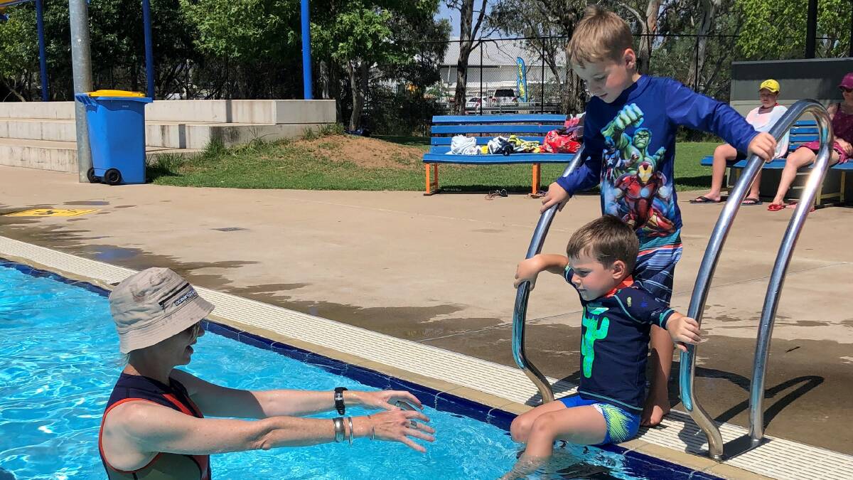 Member for Cootamundra Steph Cooke with Lachlan, 4, and Thomas Corbett, 6, at the Young Aquatic Centre last week.