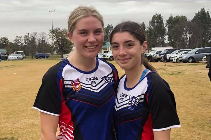 Young Cherrypickers Sienna Smith and Alyssa Wonson pictured in their Group Nine league tag colours. Photo: Young Cherrypickers RLFC (Facebook)