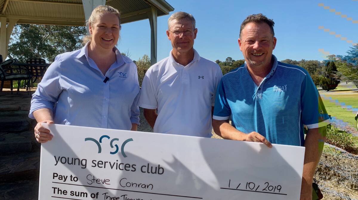 Belinda Allen presenting Steve Conran with the winner's cheque and PGA tournament director Andy Rogers.