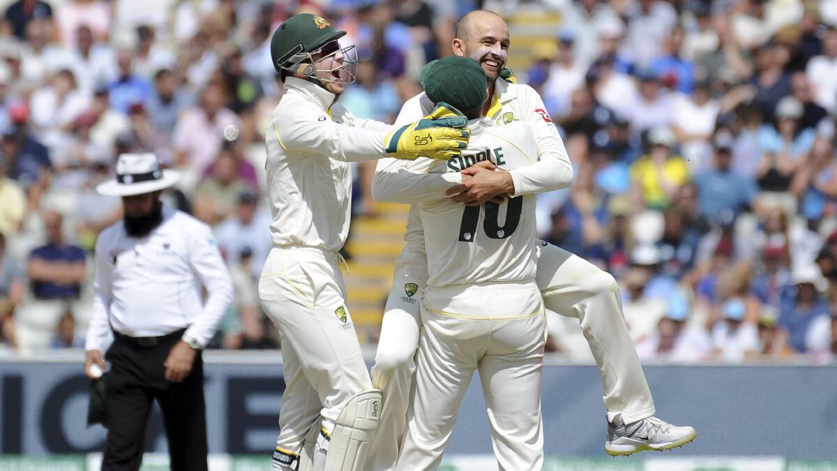 Australia's Nathan Lyon celebrates after dismissing England captain Joe Root during day five of the first Ashes Test. It was one of the six wickets he snared. Photo: AP
