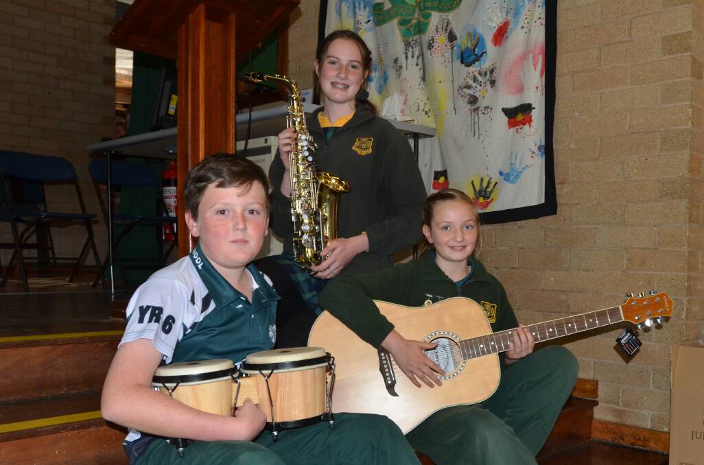 Young Public School senior band members and Year 6 students Callum Holt, Lara Noyes and Aylie Corkery with some of the new instruments.