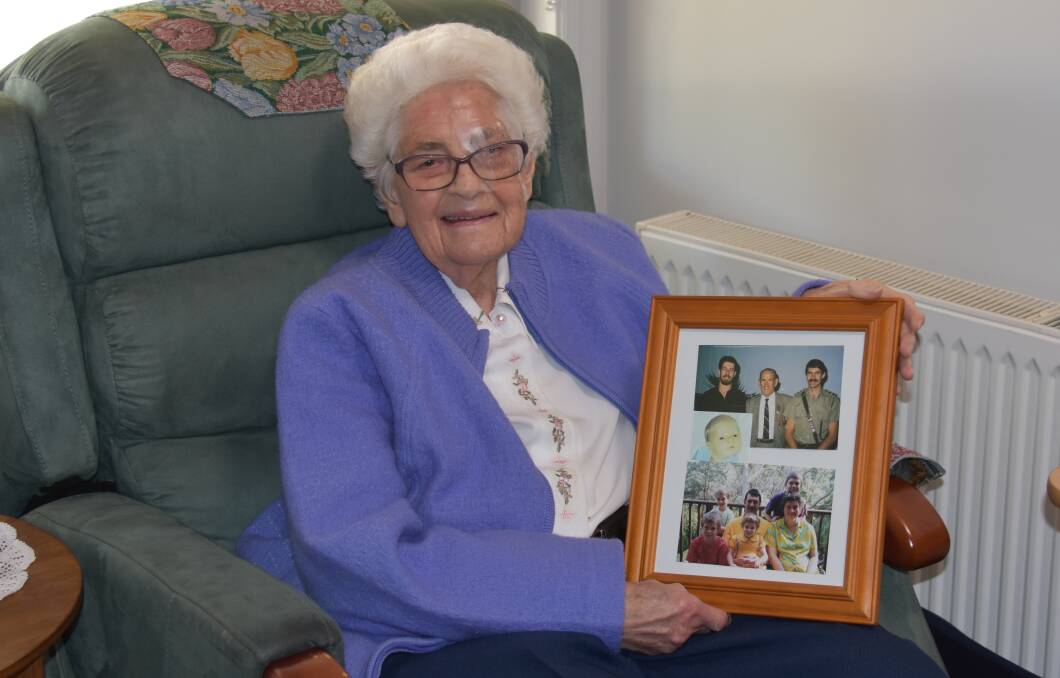 Sr Maureen Hummerston with a photo of some of her family including her father who served in WWII.