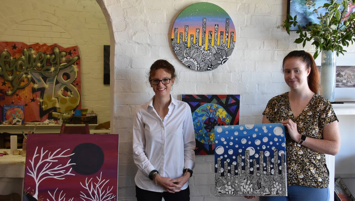 Member for Cootamundra Steph Cooke with Zoyie Lee Newham, pictured with her award winning work 'Mystery Under the Sea', at Gallery 78 on Monday. Photo: Peter Guthrie