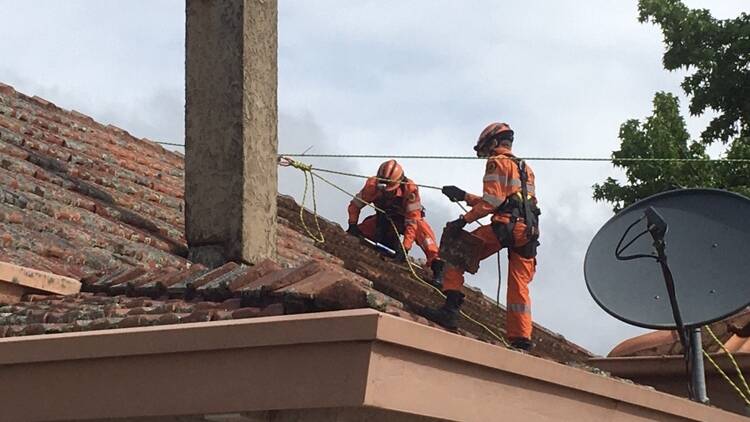 Young SES unit volunteers conduct roof repairs at a home in Young on Saturday afternoon. Photo: contributed 