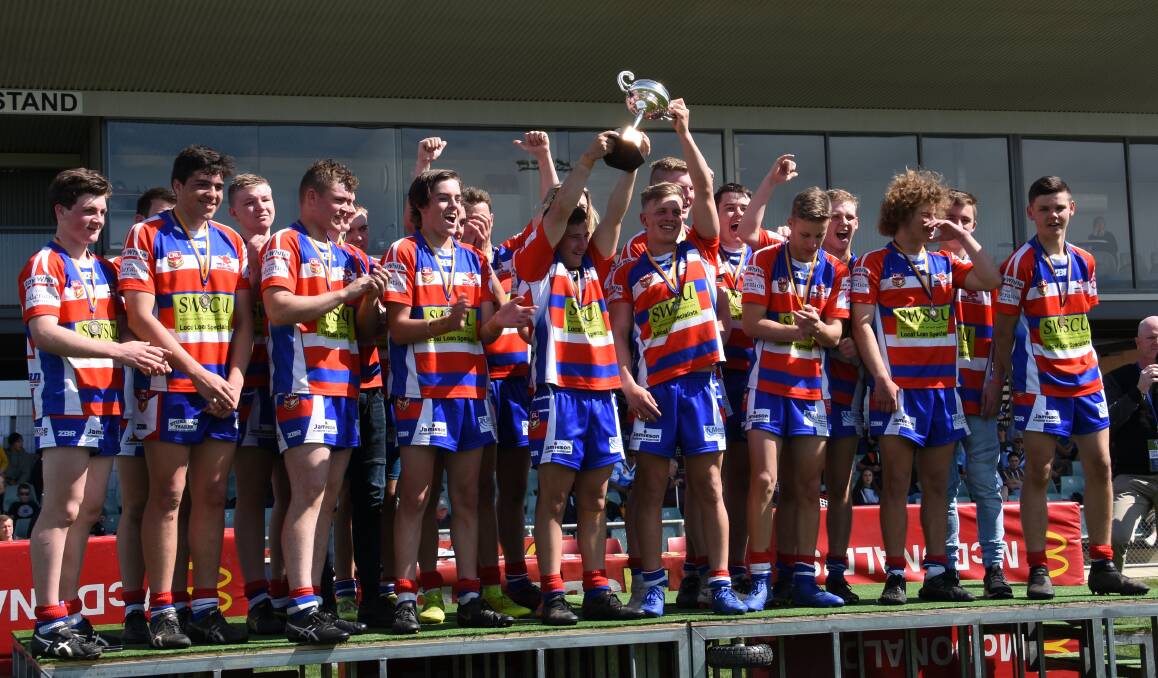 Young's under 17s lift the Sullivan Cup after a thrilling grand final victory. Photo: Penny Le Poidevin