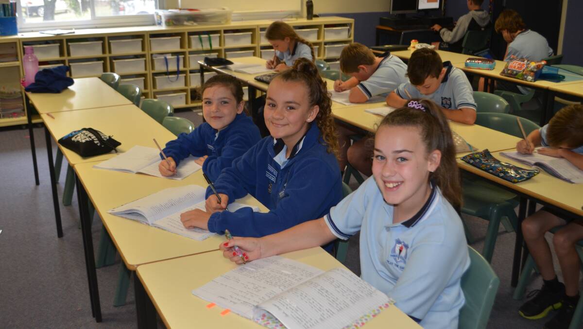 Year 5 students Georgia Griffiths, Sophie Schulz and Ella Glassett.