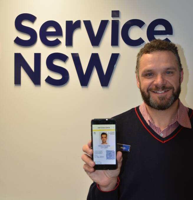 Service NSW Young employee Mark Dal Molin shows an example of a Digital Driver Licence which will be rolled out across the state next month.