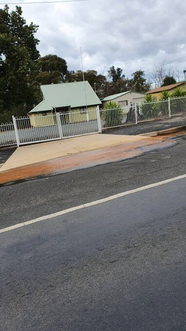 Water gushes down Campbell Street, Young following a water main break on June 20. Photo: Facebook