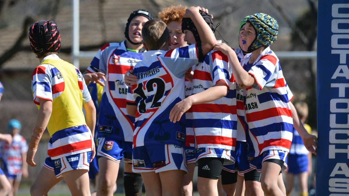 Under 12s Young Cherrypickers celebrate a try against Junee on the weekend. They are one of six Young sides set to feature in grand finals on Saturday. Photo: Sharon Corcoran