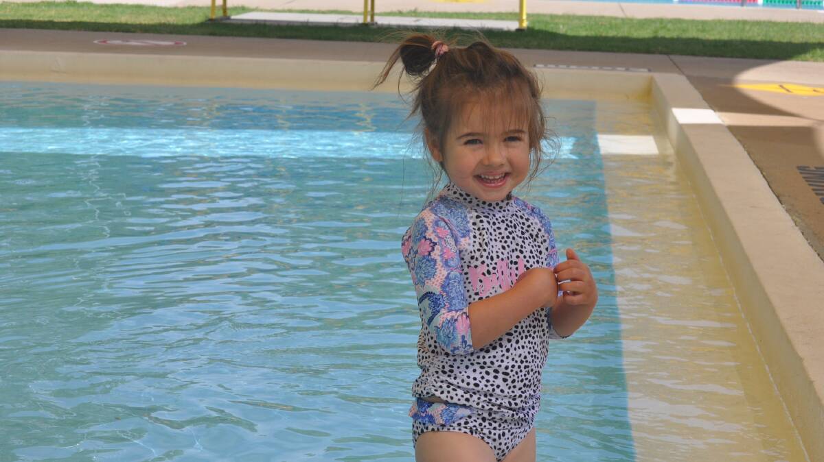 Evie Yerverton keeps cool at the Young Aquatic Centre on Thursday morning.