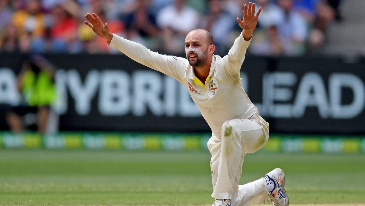 Australian spinner Nathan Lyon picked up the wicket of Rohit Sharma on day one to mark his first scalp of the summer. Photo: AAP