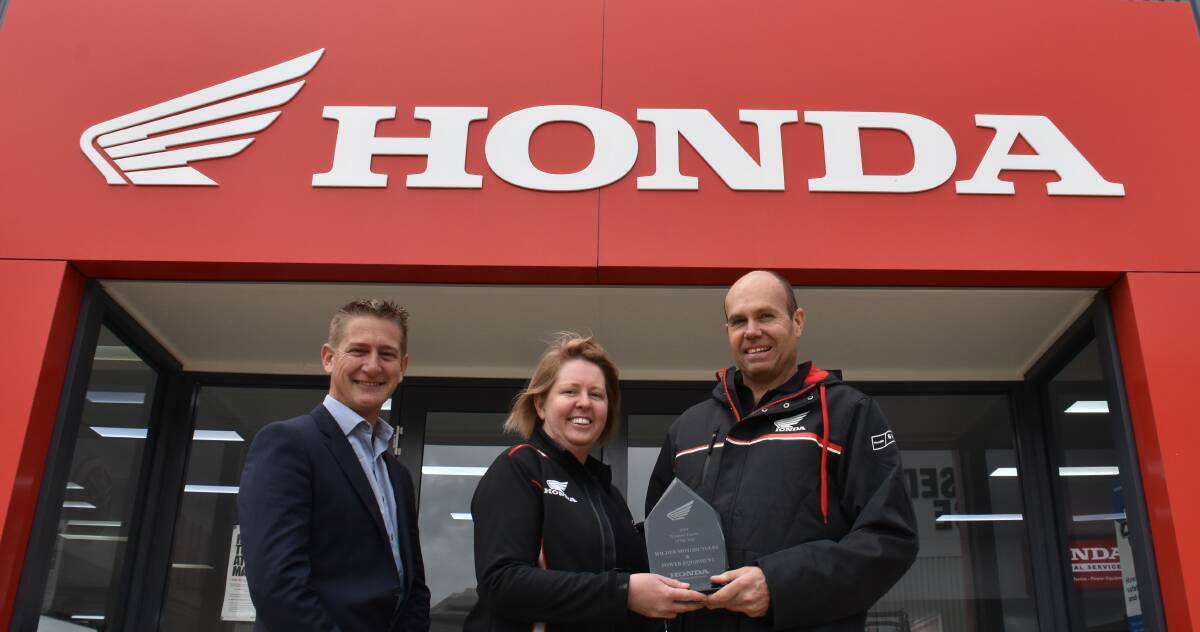 Glenn Hindle, Honda Australia, with Wilders Motorcycles and Power Equipment Young owners Tanya and Darren Wilder. Photo: Peter Guthrie