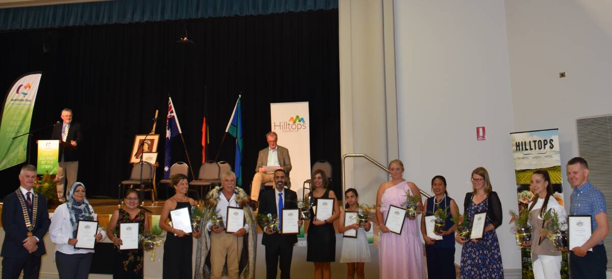 New Australian citizens from the Hilltops local government area with mayor Brian Ingram. Photo: Peter Guthrie
