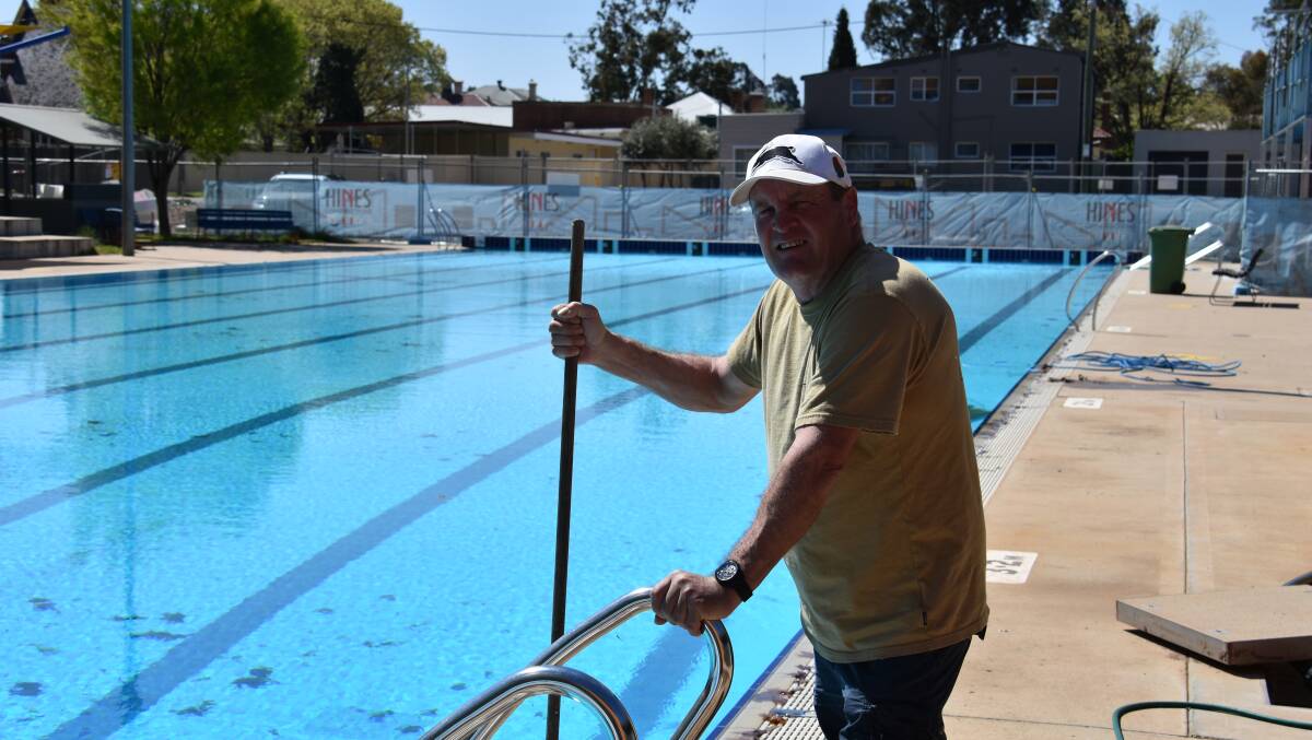 Vince Vitnell pictured poolside cleaning the pool at the Young Aquatic Centre on Friday afternoon. The pool is scheduled to open on October 12.