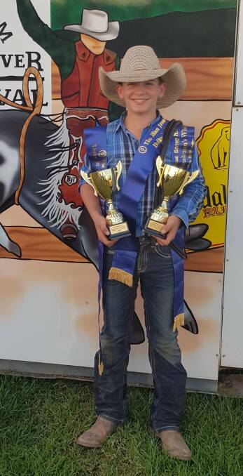 Corey McCoy with the silverware he collected at the Man From Snowy River Bush Festival.