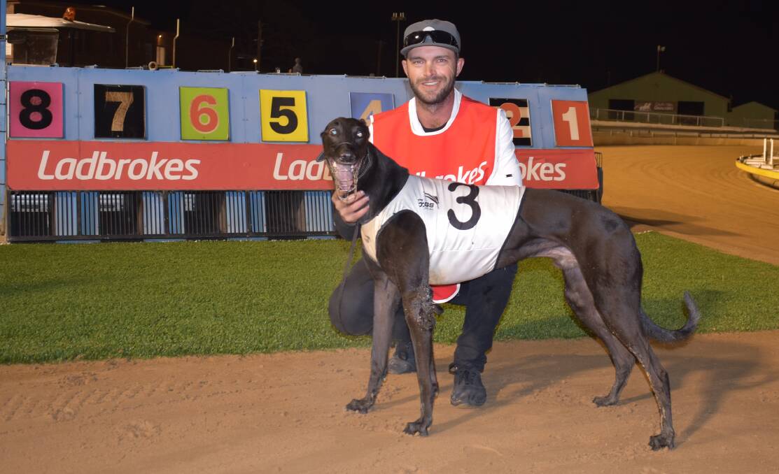 Young's Lloyd Kimber with Corleone King after winning his heat of the Wagga Gold Cup last Friday night. Photo: Courtney Rees