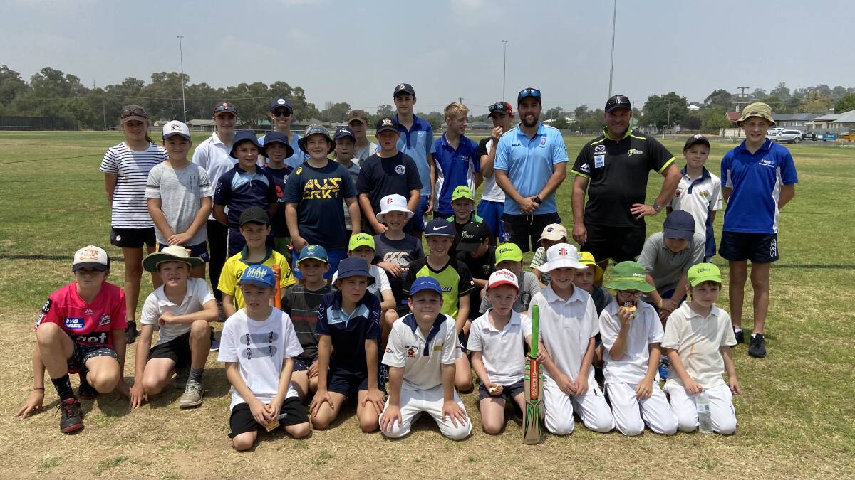 More than 30 budding cricketers enjoy a clinic at Cranfield Oval on Friday. Photo: contributed