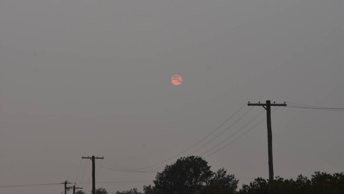 The sun behind a blanket of smoke on Saturday, December 21, the hottest day of 2019. Photo: Penny Le Poidevin
