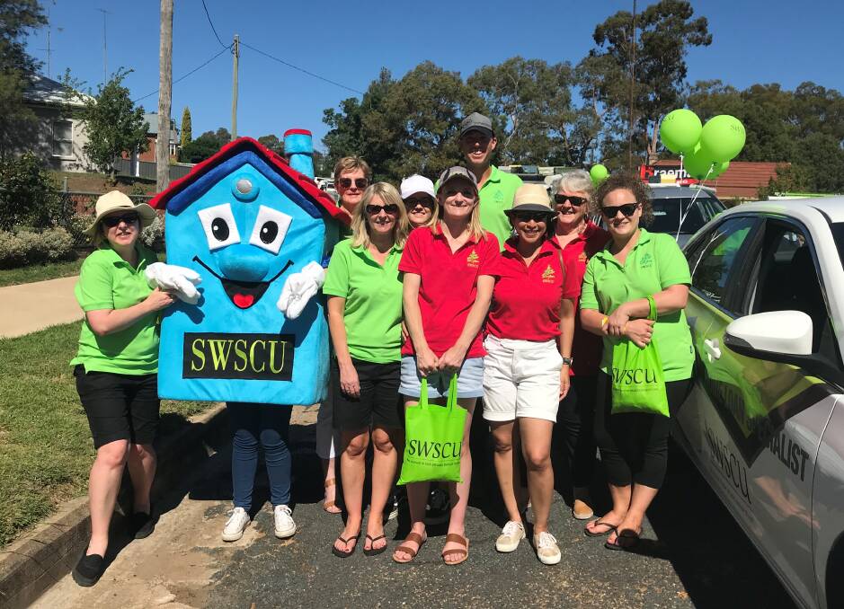 Community spirit: SWSCU employees gear up ready for the Young Cherry Festival. Photo: Supplied.