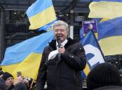 Petro Poroshenko says being blocked by authorities from leaving Ukraine is an "attack on unity". (AP PHOTO)