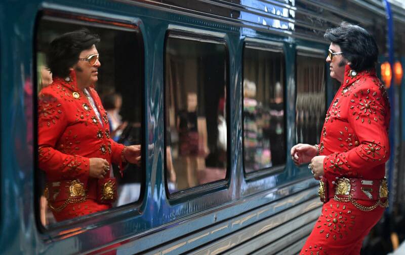 ALL ABOARD: Elvis impersonator John Collins pictured just before boarding the Elvis Express at Central Station last year.